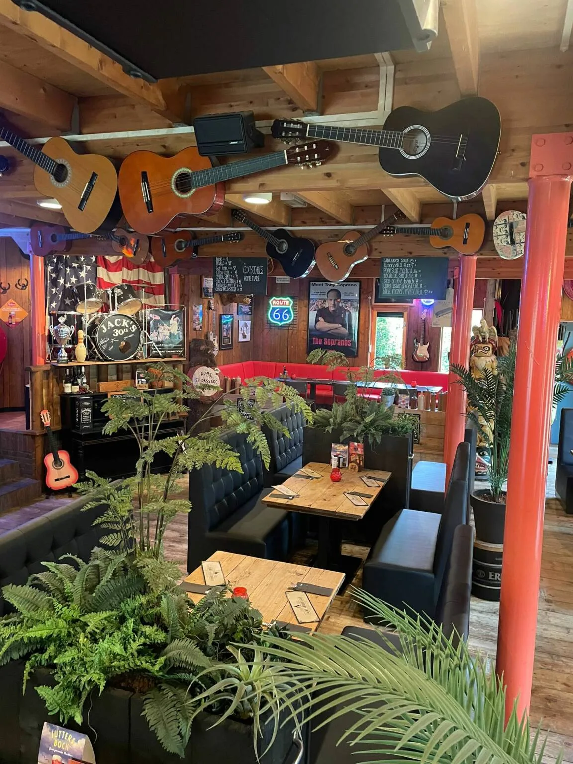The atmospheric interior of Jack's Grillhouse with guitars on the ceiling